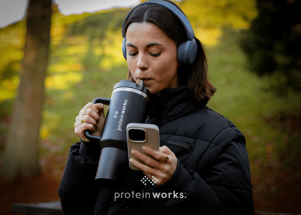Woman drinking water outside