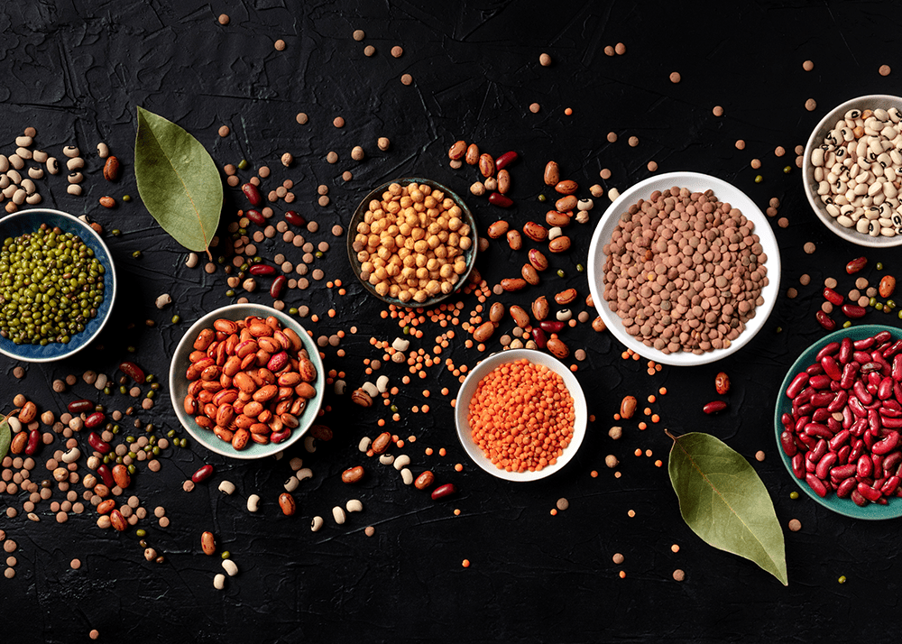Selection of nuts and beans on a dark background