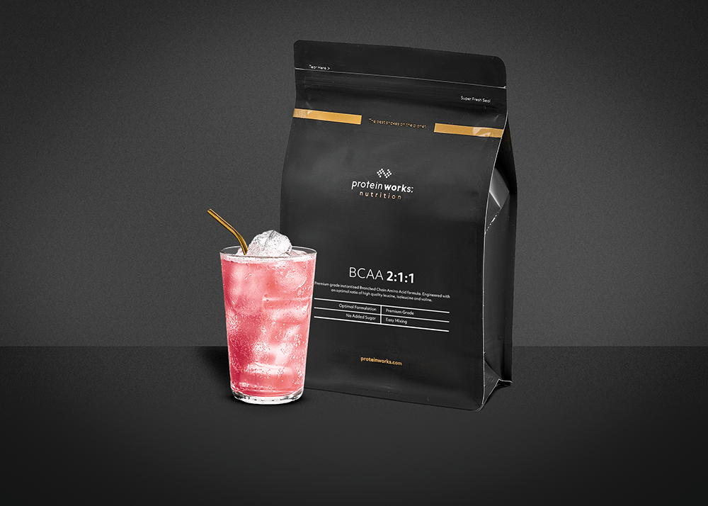 BCAAs in a glass against a dark background