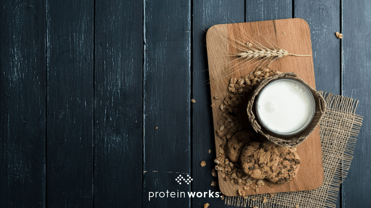 Plant-based milk on a wood chopping board